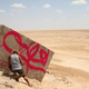 Image for article titled Photos: A “calligraffiti” artist tags buildings with beautiful Arabic calligraphy